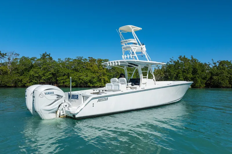  Yacht Photos Pics 2019 Jupiter 38 HFS boat with Yamaha engines on calm water, clear blue sky.