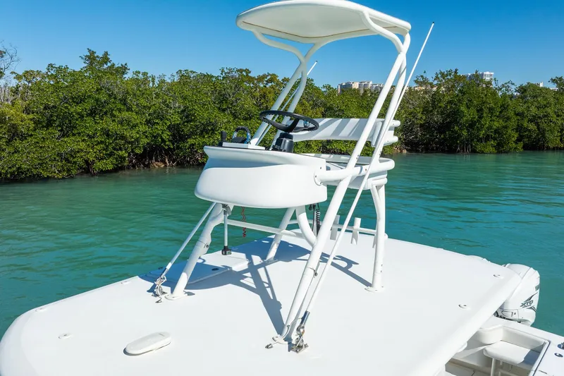  Yacht Photos Pics 2019 Jupiter 38 HFS boat with elevated helm, cruising in clear blue waters.