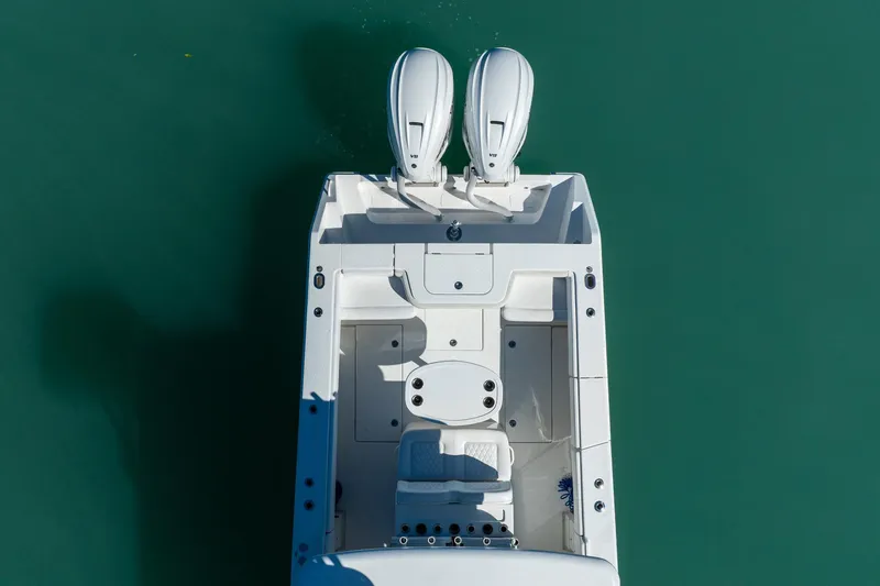  Yacht Photos Pics Overhead view of 2019 Jupiter 38 HFS boat with dual engines on turquoise water.