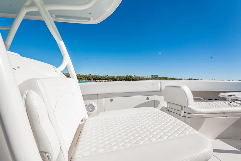  Yacht Photos Pics 2019 Jupiter 38 HFS boat interior with white seating and clear blue sky.
