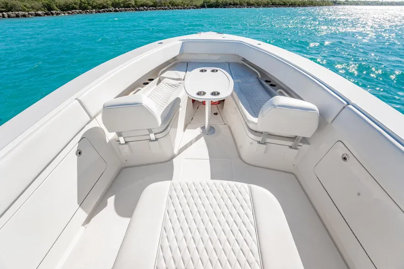  Yacht Photos Pics Luxurious 2019 Jupiter 38 HFS boat interior with white seating and turquoise water backdrop.