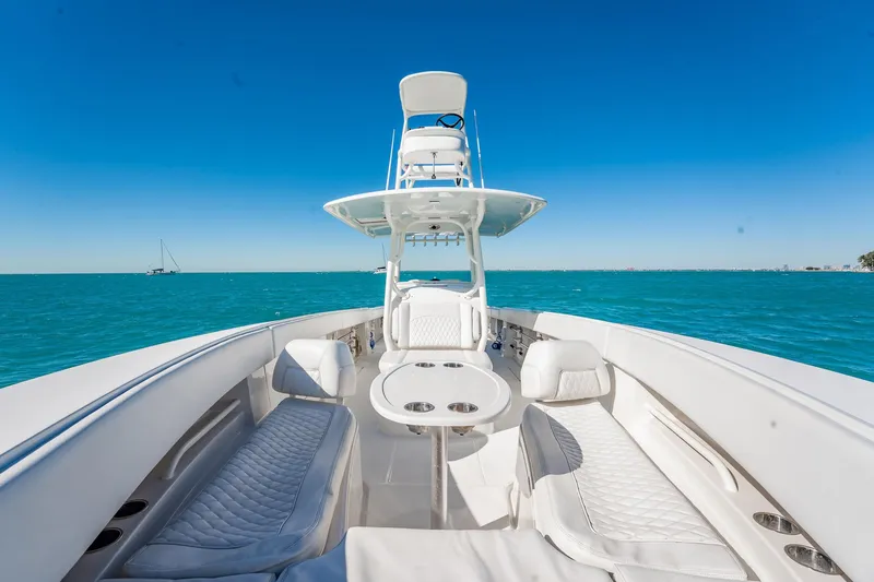  Yacht Photos Pics 2019 Jupiter 38 HFS boat on clear blue water under a bright sky.