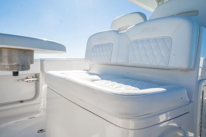  Yacht Photos Pics Luxurious seating on 2019 Jupiter 38 HFS boat with white upholstery and diamond stitching.