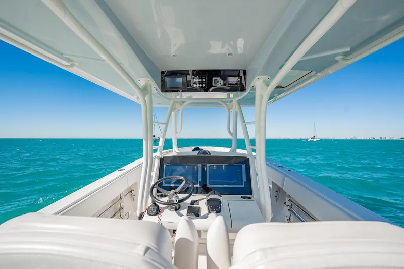  Yacht Photos Pics 2019 Jupiter 38 HFS boat interior with ocean view and navigation equipment.