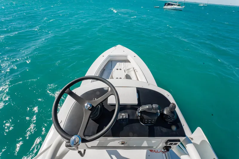  Yacht Photos Pics 2019 Jupiter 38 HFS boat steering console on turquoise ocean waters.