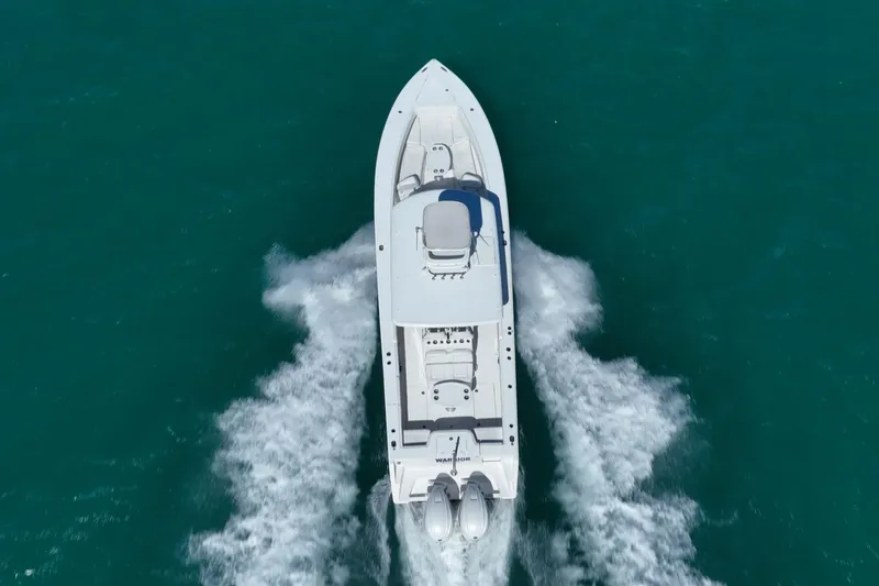  Yacht Photos Pics Aerial view of 2019 Jupiter 38 HFS boat cruising on turquoise water.