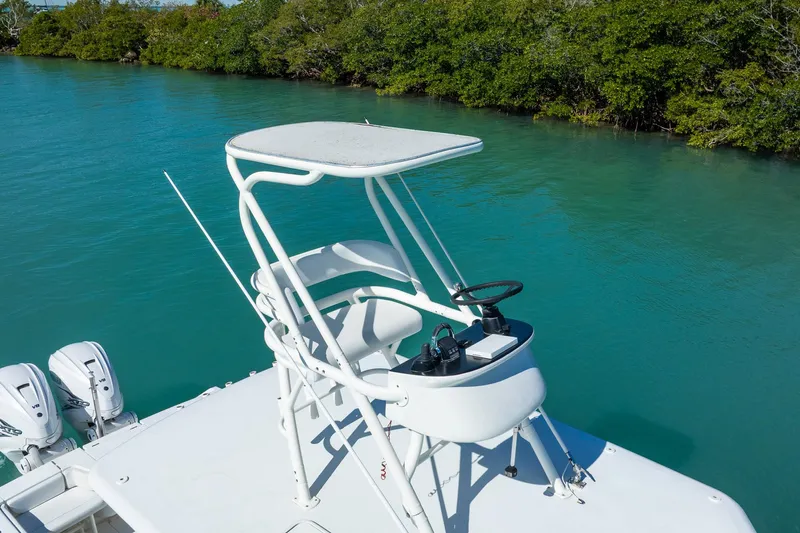  Yacht Photos Pics 2019 Jupiter 38 HFS boat with elevated helm, cruising on turquoise water.