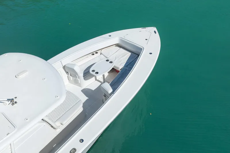  Yacht Photos Pics 2019 Jupiter 38 HFS boat on turquoise water, featuring sleek white design and seating area.