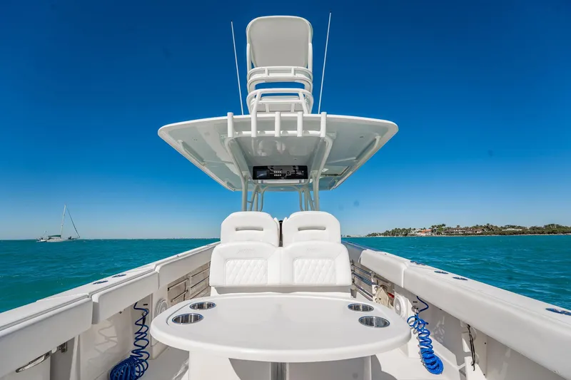  Yacht Photos Pics 2019 Jupiter 38 HFS boat on clear blue water under a bright sky.