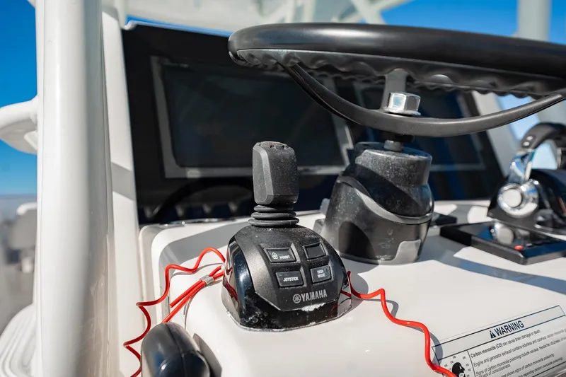  Yacht Photos Pics Close-up of 2019 Jupiter 38 HFS boat controls with Yamaha joystick and steering wheel.