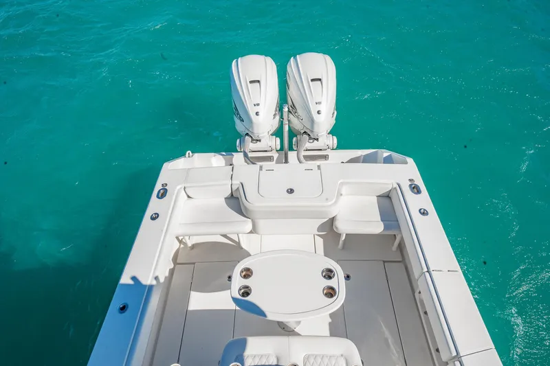  Yacht Photos Pics 2019 Jupiter 38 HFS boat with dual engines on turquoise water.