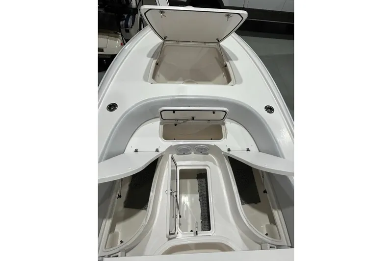  Yacht Photos Pics 2024 Contender 26 Bay boat interior with open storage compartments.