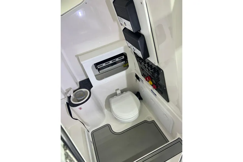  Yacht Photos Pics 2024 Sea Fox 288 Commander boat interior with toilet and control panels.