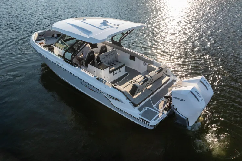  Yacht Photos Pics 2026 Monterey Elite 30 OB boat on water, featuring sleek design and powerful Mercury engines.