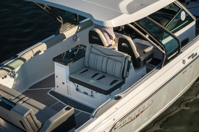  Yacht Photos Pics 2026 Monterey Elite 30 OB boat interior with luxurious seating and sleek design.