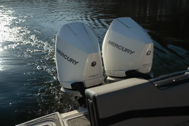  Yacht Photos Pics Twin Mercury outboard engines on a 2026 Monterey Elite 30 OB boat in water.