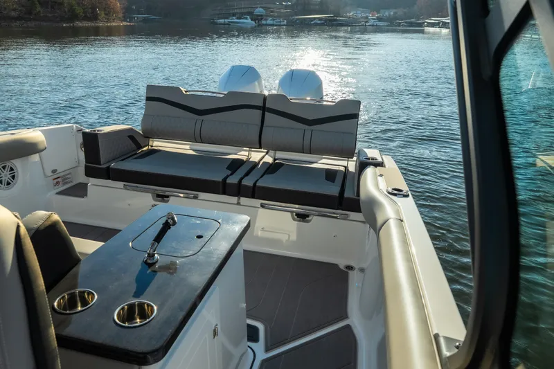  Yacht Photos Pics 2026 Monterey Elite 30 OB boat interior with seating and water view.