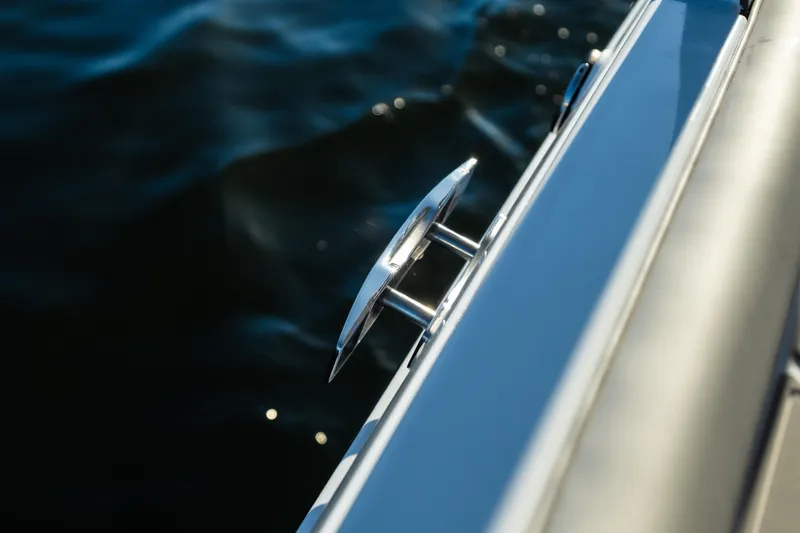  Yacht Photos Pics Close-up of 2026 Monterey Elite 30 OB boat cleat against water background.