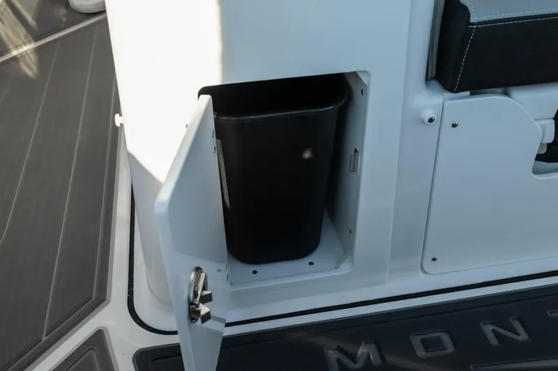 Yacht Photos Pics Storage compartment with trash bin on 2026 Monterey Elite 30 OB boat.