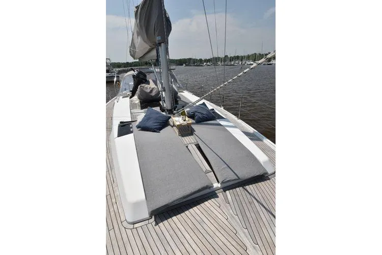 "jocale Ii" Yacht Photos Pics 2016 Hanse 455 yacht deck with cushions and pillows, docked by the water.