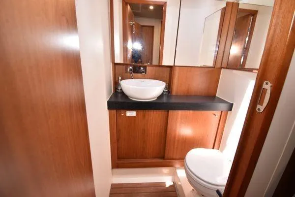 "jocale Ii" Yacht Photos Pics 2016 Hanse 455 yacht bathroom with wooden cabinetry and modern fixtures.