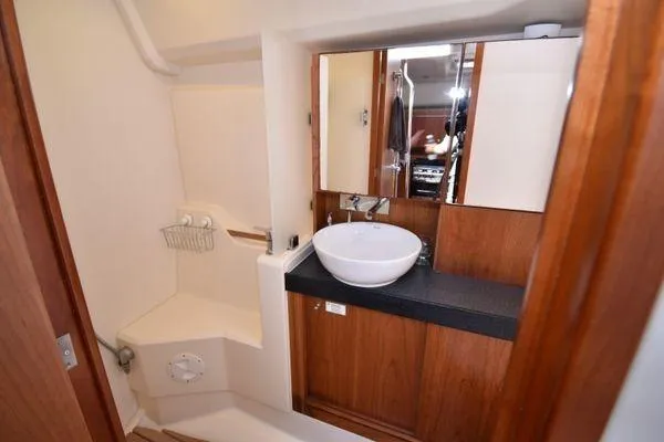 "jocale Ii" Yacht Photos Pics 2016 Hanse 455 yacht bathroom with wooden cabinetry and modern sink.
