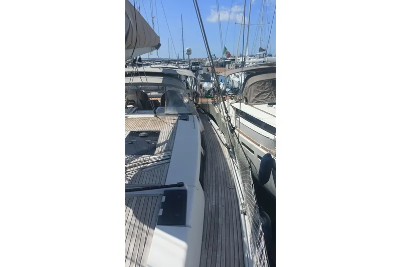 "jocale Ii" Yacht Photos Pics Sailboat Hanse 455, 2016 model, docked in a marina under clear blue skies.