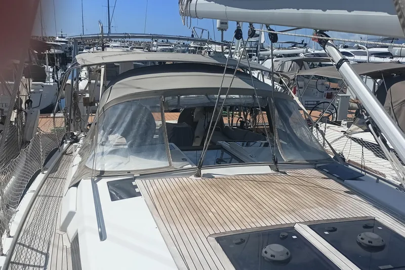 "jocale Ii" Yacht Photos Pics 2016 Hanse 455 sailboat with teak deck, docked in a marina.