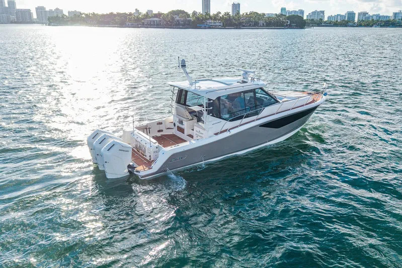  Yacht Photos Pics 2024 Boston Whaler 405 Conquest cruising on a sunny day in open waters.
