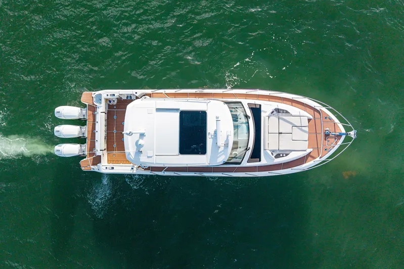  Yacht Photos Pics Aerial view of 2024 Boston Whaler 405 Conquest yacht cruising on open water.