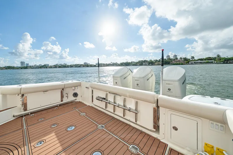  Yacht Photos Pics 2024 Boston Whaler 405 Conquest boat deck with Mercury engines on a sunny day.