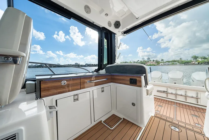  Yacht Photos Pics 2024 Boston Whaler 405 Conquest interior with sleek design and waterfront view.