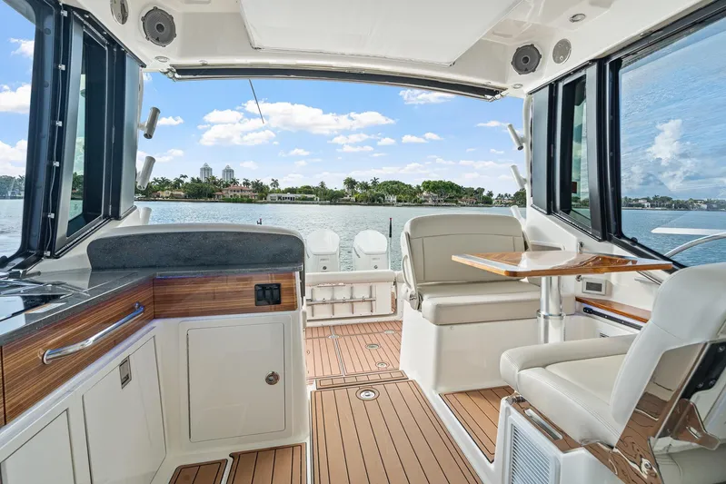  Yacht Photos Pics 2024 Boston Whaler 405 Conquest interior with luxurious seating and scenic water view.