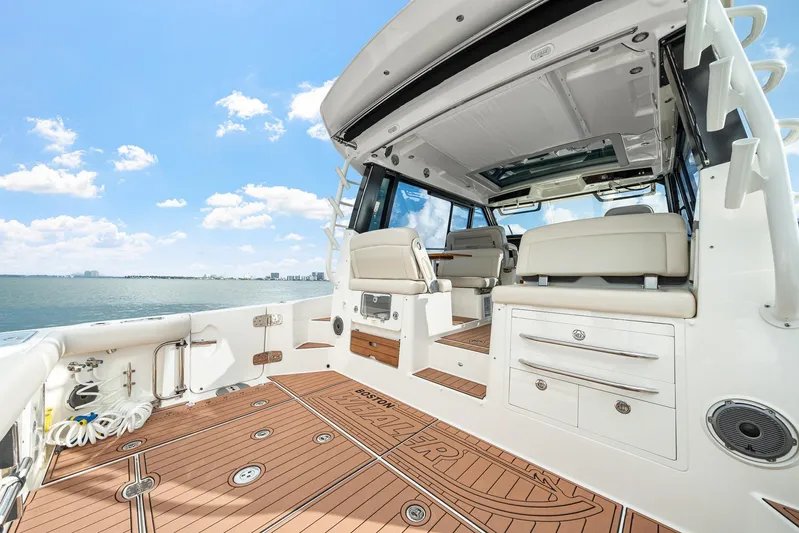  Yacht Photos Pics 2024 Boston Whaler 405 Conquest boat interior with luxurious seating and ocean view.