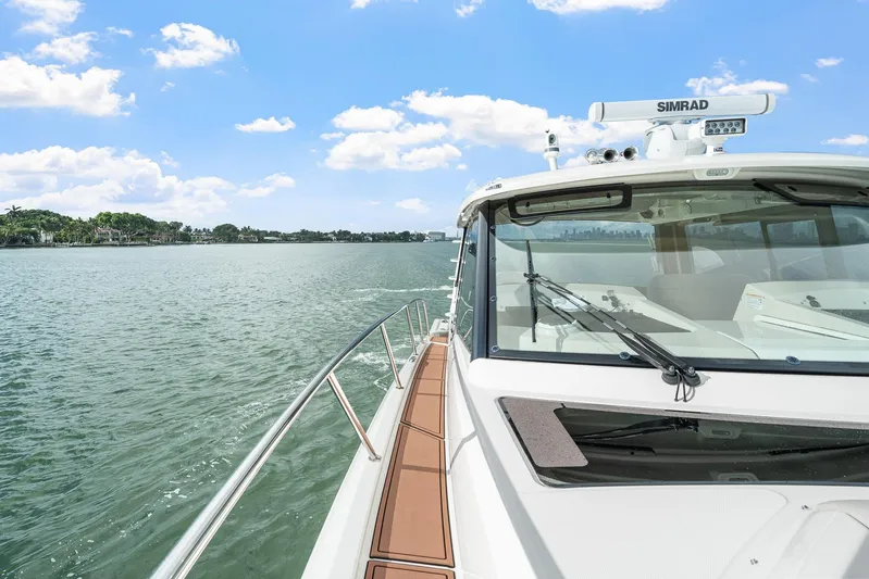  Yacht Photos Pics 2024 Boston Whaler 405 Conquest cruising on a sunny day, showcasing sleek design and advanced features.