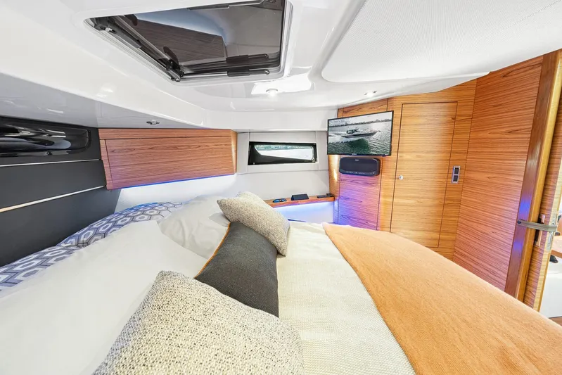  Yacht Photos Pics Luxurious interior of 2024 Boston Whaler 405 Conquest with cozy bedding and modern amenities.