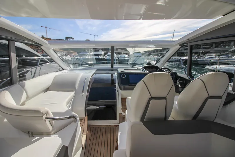  Yacht Photos Pics Luxurious 2019 Princess V50 yacht interior with modern seating and navigation controls.