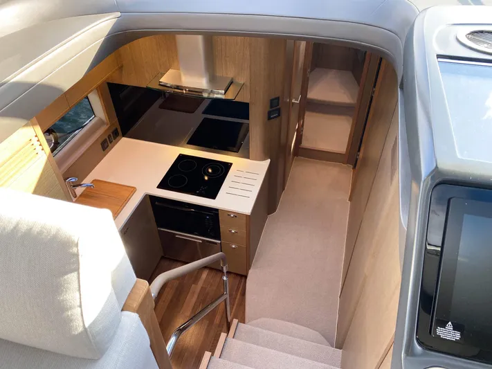  Yacht Photos Pics Luxurious 2019 Princess V50 yacht interior with modern kitchen and cozy cabin.