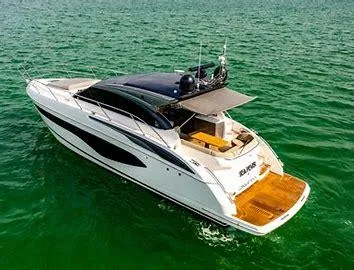  Yacht Photos Pics Luxurious 2019 Princess V50 yacht cruising on serene green waters.