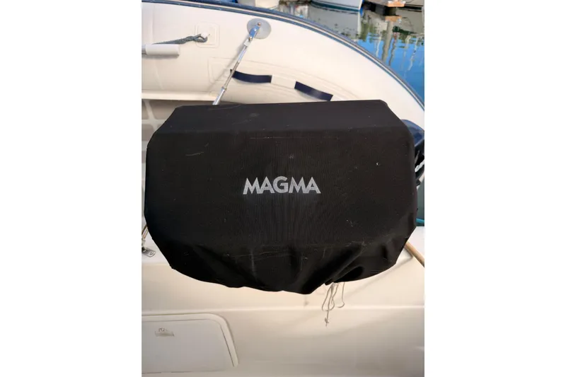  Yacht Photos Pics Black Magma grill cover on 2003 Meridian 341 Sedan boat deck.