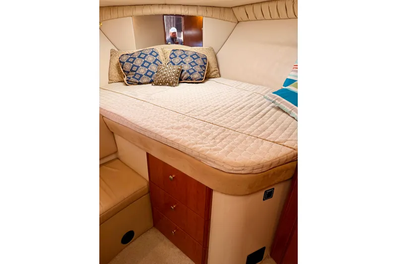  Yacht Photos Pics Luxurious cabin interior of 2003 Meridian 341 Sedan with cozy bedding and decorative pillows.