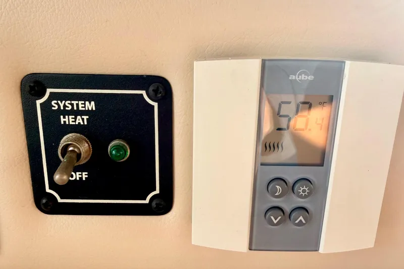  Yacht Photos Pics Thermostat and heat system switch in 2003 Meridian 341 Sedan boat interior.