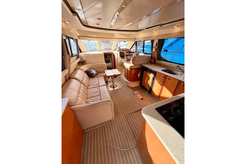  Yacht Photos Pics Luxurious interior of a 2003 Meridian 341 Sedan yacht with plush seating and modern amenities.
