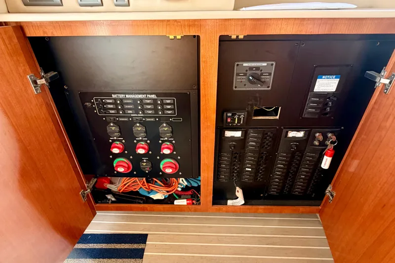  Yacht Photos Pics Battery management panel inside 2003 Meridian 341 Sedan yacht, featuring switches and wiring.