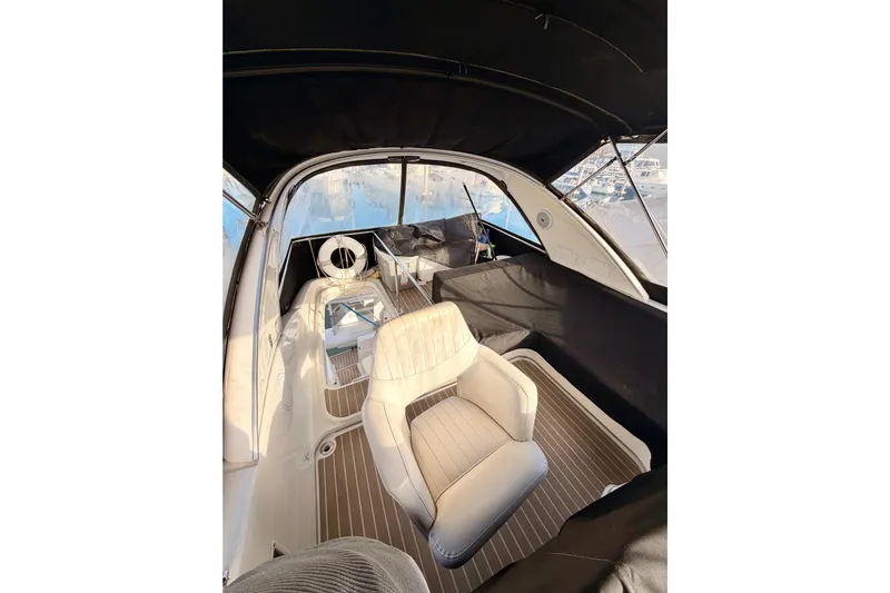  Yacht Photos Pics 2003 Meridian 341 Sedan interior with white seating and panoramic windows.