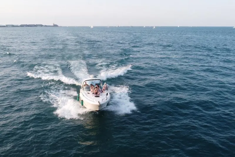  Yacht Photos Pics 2008 Sea Ray 350 Sundancer cruising on open water with passengers enjoying the ride.