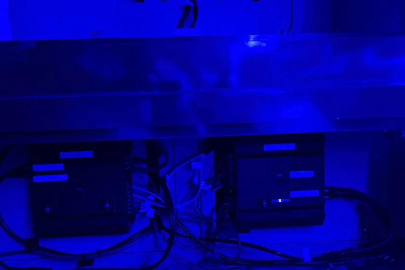  Yacht Photos Pics Electrical components in blue-lit compartment of 2008 Sea Ray 350 Sundancer boat.