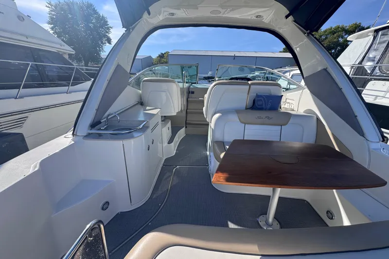  Yacht Photos Pics Interior view of a 2008 Sea Ray 350 Sundancer yacht with seating and table.