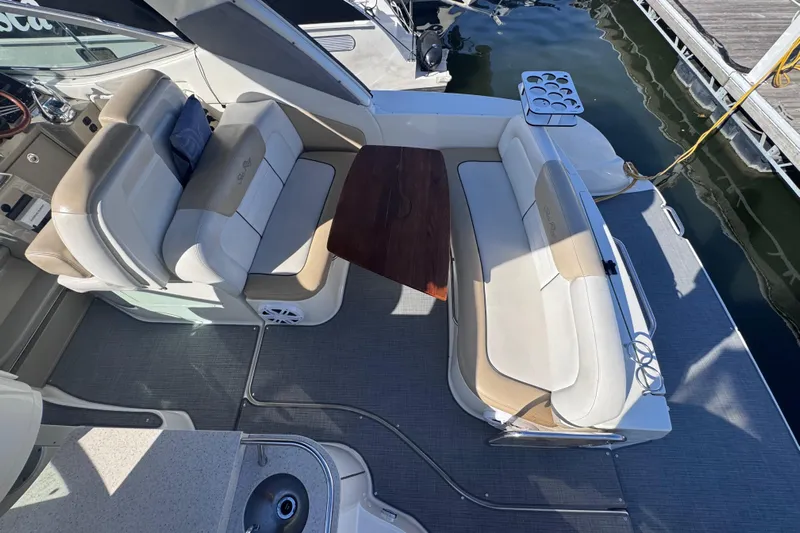  Yacht Photos Pics 2008 Sea Ray 350 Sundancer boat interior with seating and table, docked at marina.