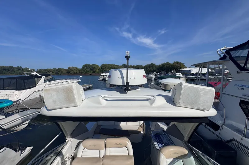  Yacht Photos Pics 2008 Sea Ray 350 Sundancer docked at marina, surrounded by other boats under clear blue sky.